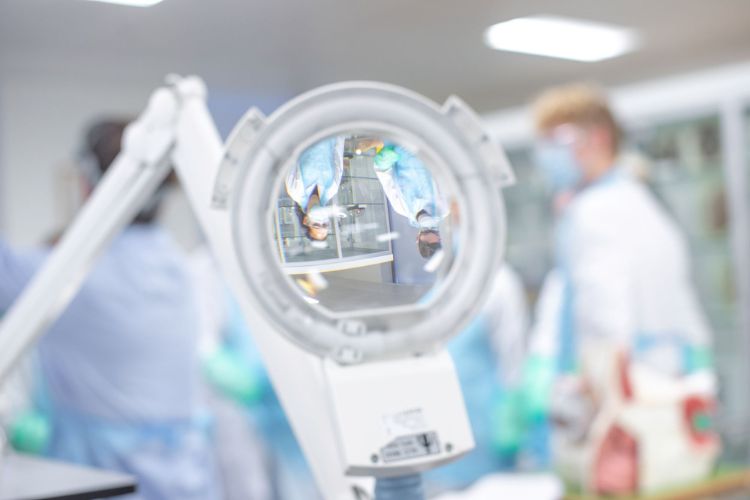 A blurred image looking through a medical magnifying glass